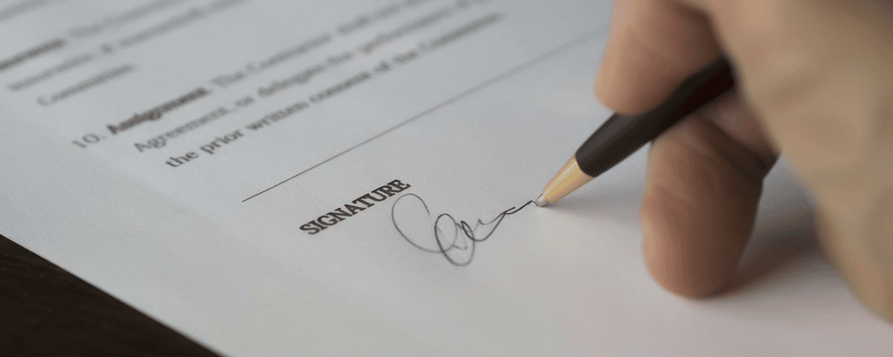 Pen signing a document.