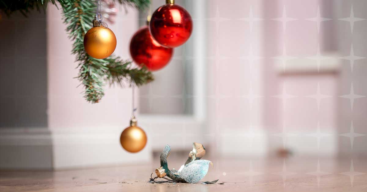 A broken bauble on the floor of a home.